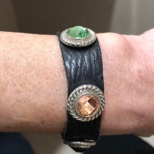 Black leather bracelet with stones.